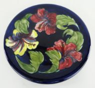 MOORCROFT POTTERY BLUE GROUND CHARGER, Hibiscus pattern, 31cms diameter