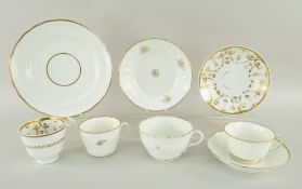 SWANSEA PORCELAIN comprising gilt and white trios, cups and saucers, two with moulded borders (