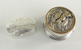 SMALL SILVER OVAL SCROLL ENGRAVED BOX WITH HINGED COVER, together with circular silver small box and