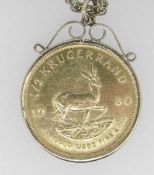 1980 1/2OZ GOLD KRUGERRAND IN 9CT GOLD MOUNT on 9ct gold chain. 27 grams overall. Condition