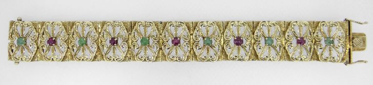 14K YELLOW GOLD SCROLL AND FLORAL TABLET BRACELET, each tablet with alternating rubies and green