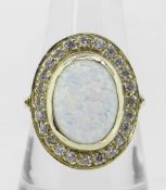 14K (585) YELLOW GOLD OVAL OPAL DRESS RING having border of twenty-four small diamonds, 6.8 grams.