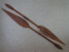 AFRICAN CARVED PADDLE SPEARS, a pair, 164cms approximate length