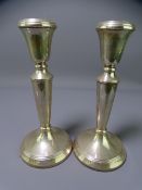 SILVER CANDLESTICKS, a pair, Birmingham 1988, maker M Kamin & Co, 18cms H filled