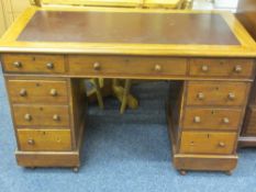 LATE VICTORIAN MAHOGANY TWIN PEDESTAL DESK the top having rexine insert over an arrangement of