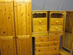 FOUR ITEMS OF MODERN PINE BEDROOM FURNITURE including a two door wardrobe, 188cms H, 81cms W, 52.
