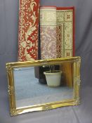 REPRODUCTION GILT FRAMED WALL MIRROR and two modern red ground rugs