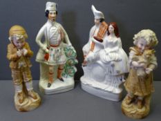 TWO STAFFORDSHIRE FLATBACKS and a pair of biscuit porcelain figurines of a young boy and girl