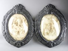 BASS RELIEF PLAQUES, a pair with convex glass over biblical studies. In the style of E.Cassier,