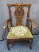 ANTIQUE MAHOGANY CHIPPENDALE STYLE ARMCHAIR with pierced scroll carved back, shaped and swept arms