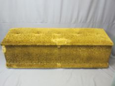 ANTIQUE PINE BLANKET BOX upholstered and with lined interior on modern castors, 47cms H overall,