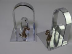 ART DECO CHROME & BRONZE BOOKENDS, a pair, double arched form on a platform base with stylized