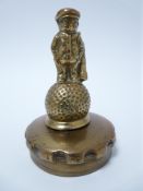 VINTAGE CAR MASCOT-DUNLOP GOLF CADDY figure standing on a Dunlop 31 stamped golf ball, circa