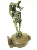 VINTAGE CAR MASCOT-CONTORTIONIST after E Carlier, French, bears signature, 13cms H.