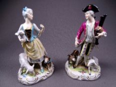 DRESDEN. PAIR OF RUSTIC FIGURINES, man with bagpipes and dog and sheep and lady with dog, sheep