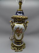 TABLE LAMP. Continental porcelain and ormolu, deep blue ground with ribbon and scrolled handles