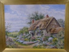 GEORGE H HUGHES. Watercolour-thatched cottage with lady in floral bedecked garden, signed, 34x47