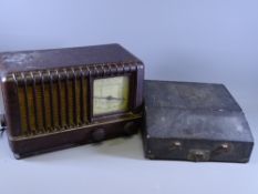 A MULLARD BAKELITE encased valve radio and a cased portable typewriter