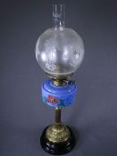 OIL LAMP on brass Corinthian column with floral painted blue reservoir and etched glass shade