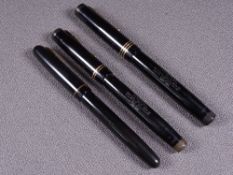 MABIE TODD - Three vintage 1940s black Swan Mabie Todd fountain pens with gold trim and 14ct gold
