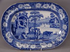 BLUE AND WHITE TURKEY PLATTER- 2 Romanesque figures on a plinth with 2 drovers and cattle by a river