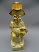 EARLY SALT GLAZED ENGLISH TOBY JUG, seated, one-armed drinking figure with top hat lid, 30 cms