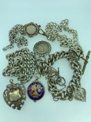 SILVER AND WHITE METAL WATCH chains and fobs to include a 1900 fob and enamelled 1949 cricket fob