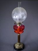 OIL LAMP on brass Corinthian column with cranberry glass reservoir and etched shade