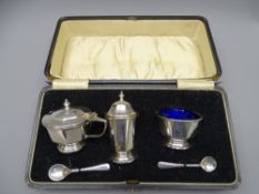 SILVER 3-PIECE CASED CONDIMENT set with pair of spoons, 3 ounces Birmingham 1930