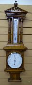 WALL BAROMETER. IN FINE QUALITY OAK OF PILLARED architectural design with mercury thermometer and