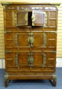 ORIENTAL WALNUT AND BRASS STANDING CABINET, possibly early 20th century having 4 small narrow top