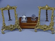 PAIR OF GILT METAL EASEL PORTRAIT FRAMES and a neat mahogany based chrome calendar and ink bottle