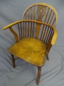 AN ELM WINDSOR CHAIR with crinoline stretcher 90cms high