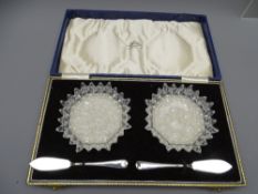 A CASED PAIR OF STAR-CUT BUTTER dishes with silver knives Sheffield 1963