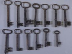 18TH AND 19TH CENTURY ORNATE IRON KEYS a parcel