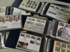 NINE SIMILAR BLUE ALBUMS OF ISLE OF MAN FIRST DAY COVERS each folder titled 'Isle of Man Post Office
