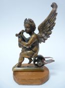 VINTAGE CAR MASCOT- WINGED CHERUB WITH LYRE seated on a wheel, possibly mounted as a mascot, LOZENGE