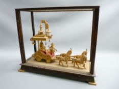 CARVED WOOD INDIAN DISPLAY depicting a horse drawn carriage, cased (glass missing)