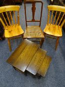 OCCASIONAL FURNITURE: A QUANTITY including a set of three oak tables, two pine farmhouse chairs, a