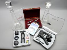 TWO MODERN GLASS DECANTERS & THREE CASED SETS OF WINE & CHAMPAGNE CORKING TOOLS, STOPPERS