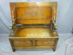 QUALITY MID-CENTURY OAK MONKS BENCH with standing lion arms and further carved detail, 72.5cms