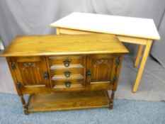 PRIORY-STYLE OAK SMALL SIDEBOARD of three central drawers and linen fold carved cupboard doors above