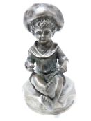 VINTAGE CAR ACCESSORY MASCOT- YOUNG SEATED BOY wearing a hat and holding a ball, 9cms H.