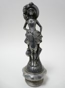 VINTAGE CAR MASCOT- MRS EVE standing woman in bonnet and bodice holding a large leaf in front with