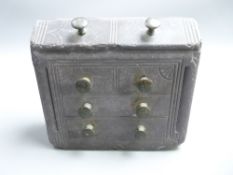 WELSH FOLK ART SLATE DOOR STOP in the form of a bureau chest, having brass knobs, 14.5cms high x