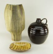 THREE POTTERY ITEMS including slip ware dish with lattice glaze, large bulbous ribbed studio potter