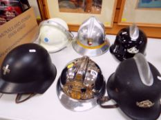 SIX VARIOUS EUROPEAN FIRE BRIGADE HELMETS including Swiss Civil Defence fire helmet, French