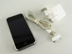 FIRST GENERATION iPHONE 8GB with charging cord and three pin plug (2) Condition report: lower left
