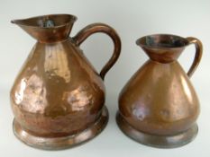 TWO ANTIQUE COPPER MEASURING JUGS the larger stamped with 4 gallons, the smaller 2 gallons, both