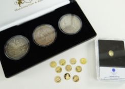 ELEVEN MINIATURE GOLD COINS believed all 585, 0.5gms, together with cased set of three Queen